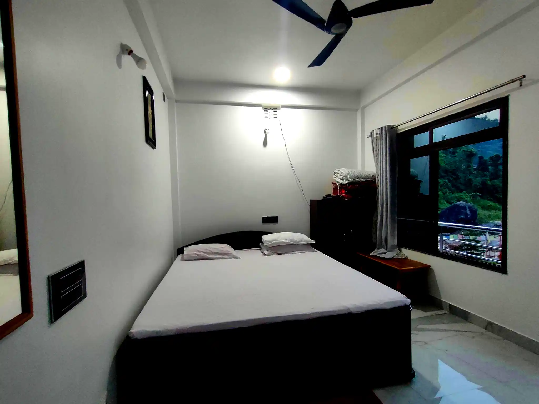 Jhalong River view resort bed room